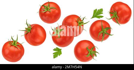 Falling cherry tomatoes isolated on white background Stock Photo