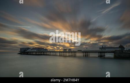 Long exposure image of Cromer Pier, Norfolk at sunrise Stock Photo