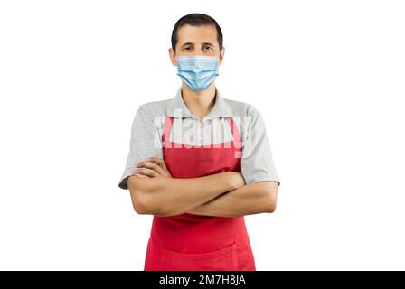 Business owner in red apron wearing a face mask to avoid coronavirus with white background - Pandemic lifestyle concepts Stock Photo