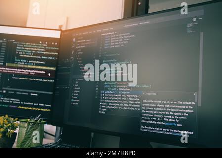 Coder programmers working in office, Programmer analyst writing code - coding program on screen computer for learning and developing programs digital Stock Photo