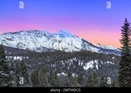 pre-dawn sky over sacagawea peak in winter in the bridger mountains near bozeman, montana Stock Photo