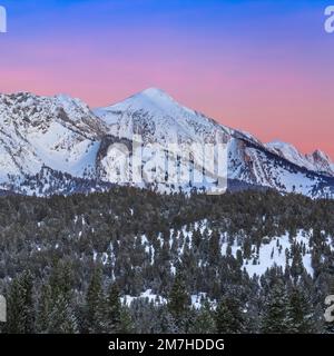 pre-dawn sky over sacagawea peak in winter in the bridger mountains near bozeman, montana Stock Photo