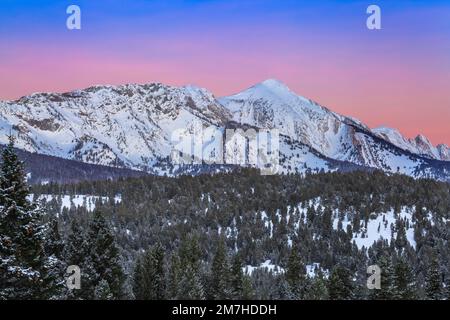 pre-dawn sky over sacagawea peak in winter in the bridger mountains near bozeman, montana Stock Photo