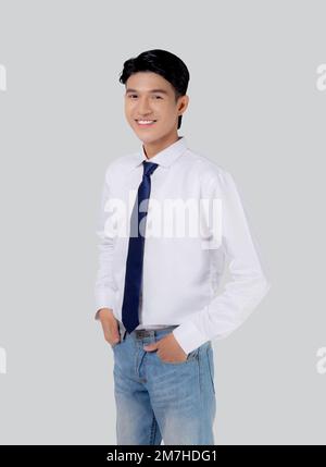 Portrait young asian businessman with confident and friendly isolated on white background, business man smart with success hands in pocket, manager or Stock Photo