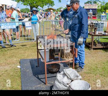 NEW ORLEANS, LA, USA - APRIL 29, 2022: Blacksmith demonstrating the toolmaking craft at the New Orleans Jazz and Heritage Festival Stock Photo