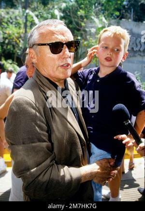 Dennis Hopper & his son attending the opening of Jurassic Park at the Universal Studios Tour in 1996 Credit: Ron Wolfson  / MediaPunch Stock Photo