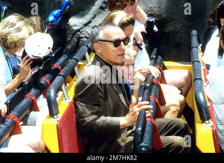 Dennis Hopper & his son attending the opening of Jurassic Park at the Universal Studios Tour in 1996 Credit: Ron Wolfson  / MediaPunch Stock Photo