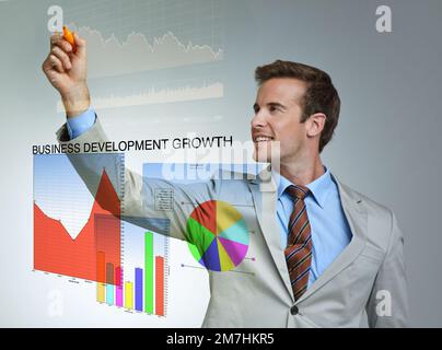 Using modern technology for interactive business. a businessman using a digital interface. Stock Photo