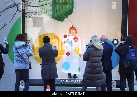 View of the Yayoi Kusama robot painting spots on the window of the luxury  retailer Louis Vuitton's Fifth Avenue store, New York, NY, January 9, 2023.  This is the second time that