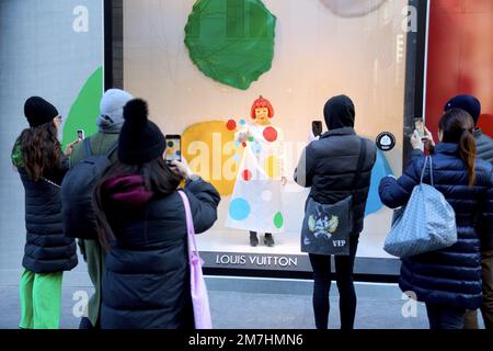 View of the Yayoi Kusama robot painting spots on the window of the luxury  retailer Louis Vuitton's Fifth Avenue store, New York, NY, January 9, 2023.  This is the second time that