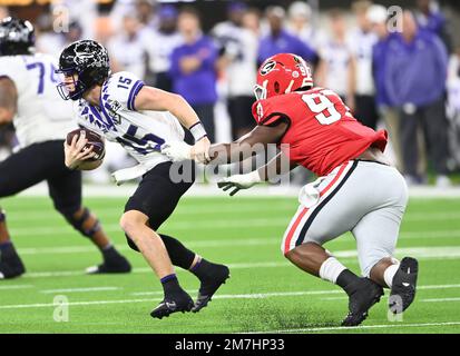 Inglewood, United States. 09th Jan, 2023. Georgia Bulldogs defensive lineman Warren Brinson (97) pursues TCU Horned Frogs quarterback Max Duggan (15) during the second half the CFP National Championship game at SoFi Stadium in Inglewood, California, on Monday, January 9, 2023. Georgia defeated TCU 65-7. Photo by Mike Goulding/UPI Credit: UPI/Alamy Live News Stock Photo