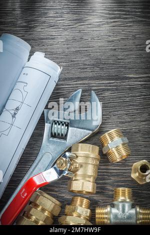 Adjustable wrench plumbing pipe fittings rolled blueprints Stock Photo ...
