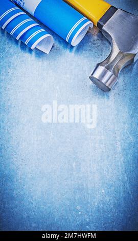 Blue construction drawings claw hammer on metallic background copyspace ...