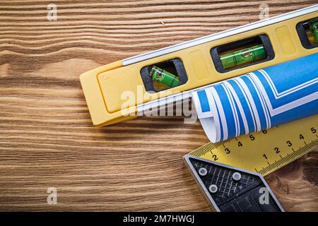 Blue engineering drawing square ruler construction level on wooden ...