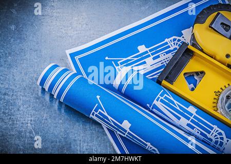 Blue engineering drawings level tape line on metallic background. Stock Photo