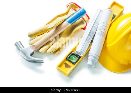 blueprints construction level helmet gloves hammer isolated on white Stock Photo