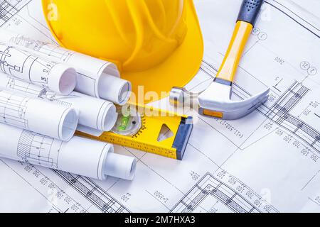 claw hammer construction level helmet rolled blueprints horizontal version Stock Photo