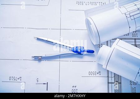 compass and two rolled up white blueprints Stock Photo - Alamy