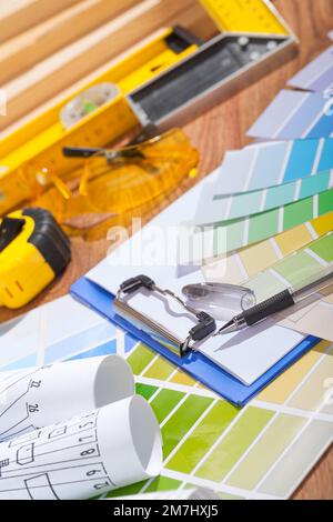color palette and blueprints on table with other tools Stock Photo