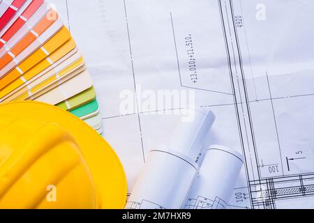 yellow helmet color palette rolled blueprints Stock Photo - Alamy