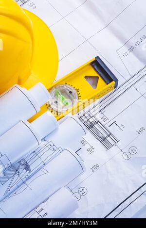safety helmet with rolled blueprints and construction plans Stock Photo ...