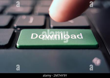 DOWNLOAD word concept green button on black keyboard Stock Photo