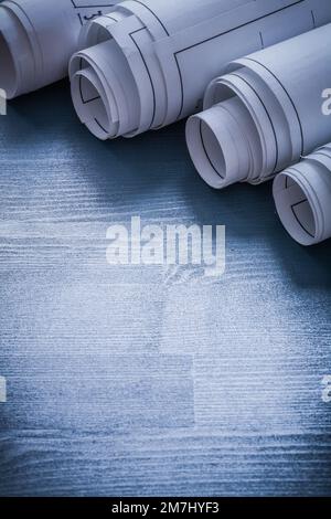 Five blueprints rolled up on blue board Stock Photo - Alamy