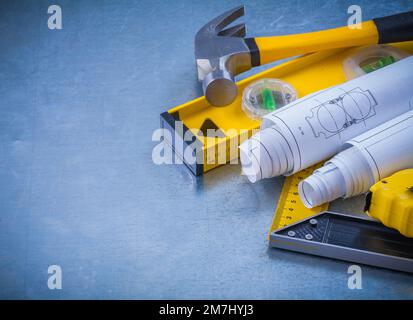 Construction Masuring Ruler Image Construction plans measuring line square ruler and claw hammer on ...