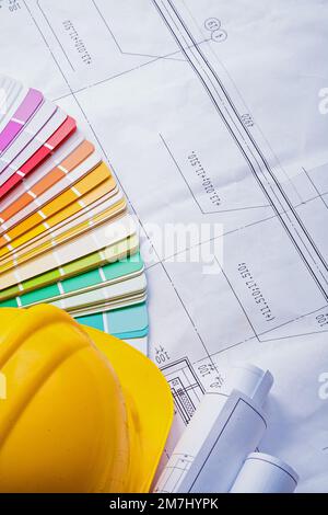 yellow helmet color palette rolled blueprints Stock Photo - Alamy