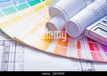 rolled blueprints on color palette Stock Photo