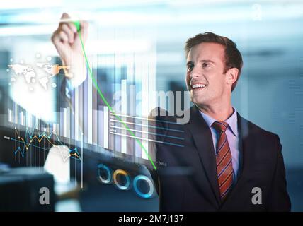 Technology Essential in modern business. a handsome young businessman using a digital interface. Stock Photo