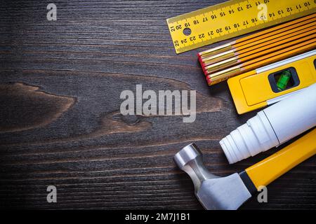 Set of building objects for maintenance works on vintage wooden surface copy space image construction concept. Stock Photo