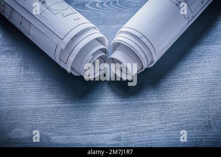 two rolls of blueprints on white wooden meter Stock Photo - Alamy