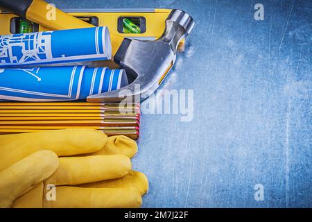 Working gloves claw hammer rolled construction drawings level wooden ...