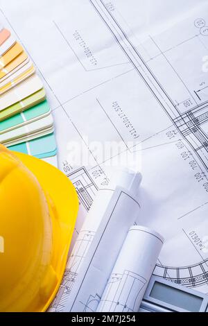 yellow helmet color palette rolled blueprints Stock Photo - Alamy