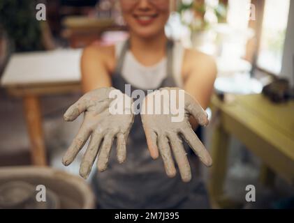 Pottery, messy and clay hands of a woman at a workshop for creative small business, art and working on design. Mud, show and professional artist in a Stock Photo