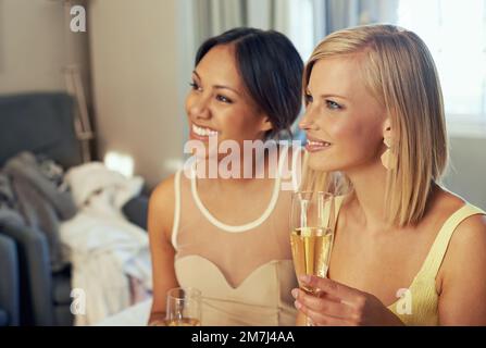 Sipping champaign while shopping. two attractive young women sitting and drinking champagne. Stock Photo