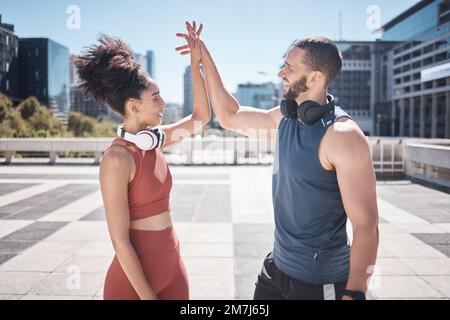 Holding hands, support and couple training in the city, fitness motivation and cardio success in Brazil. Love, achievement and excited athlete man and Stock Photo
