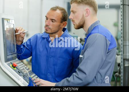 the colleagues working in garage Stock Photo
