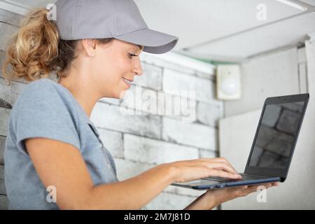 female young woman working on a laptop computer Stock Photo