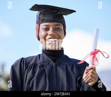 University diploma, graduation and portrait of a black man at campus to ...