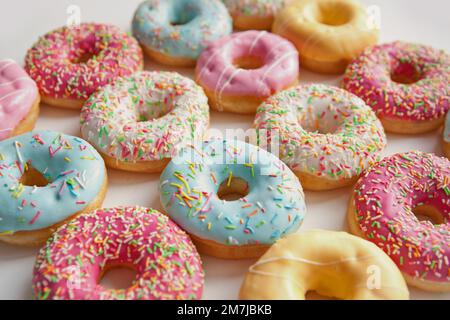 Different color donuts isolated on white background. Fast food Stock Photo