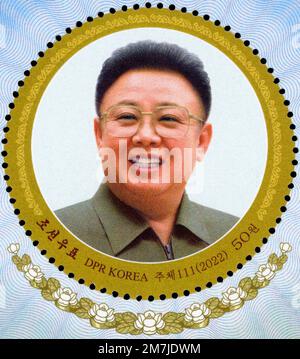 2022 North Korea stamp. 80th birthday anniversary of Kim Jong Il with -Baekdusan secret camp building and mountain with propaganda slogans Stock Photo