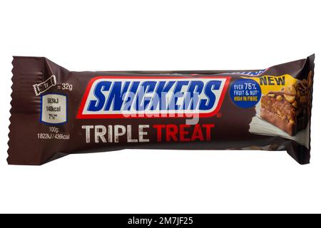 Snickers Triple Treat Fruit, Nut & Chocolate date raisin and peanut bar topped with peanuts, dipped and drizzled with milk chocolate isolated on white Stock Photo