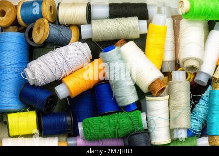 Multicolored sewing threads in box top view. Stock Photo