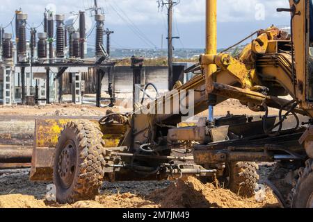 The old rusty yellow machinery in the industrial area Stock Photo