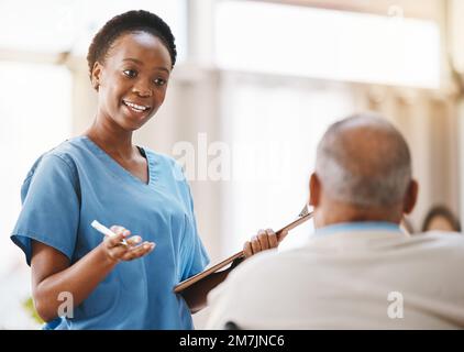 Consulting, medical and checklist with old man and nurse for retirement, rehabilitation or physical therapy. Help, empathy and healing with patient Stock Photo