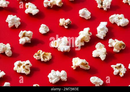 Popcorn pattern on red background with hard shadow Stock Photo
