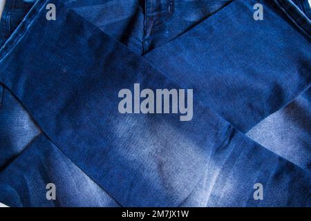 folded blue jeans pant pattern texture background Stock Photo