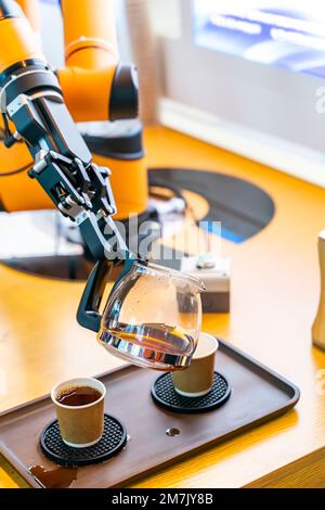 automatic arm preparing coffee in coffee machine Stock Photo